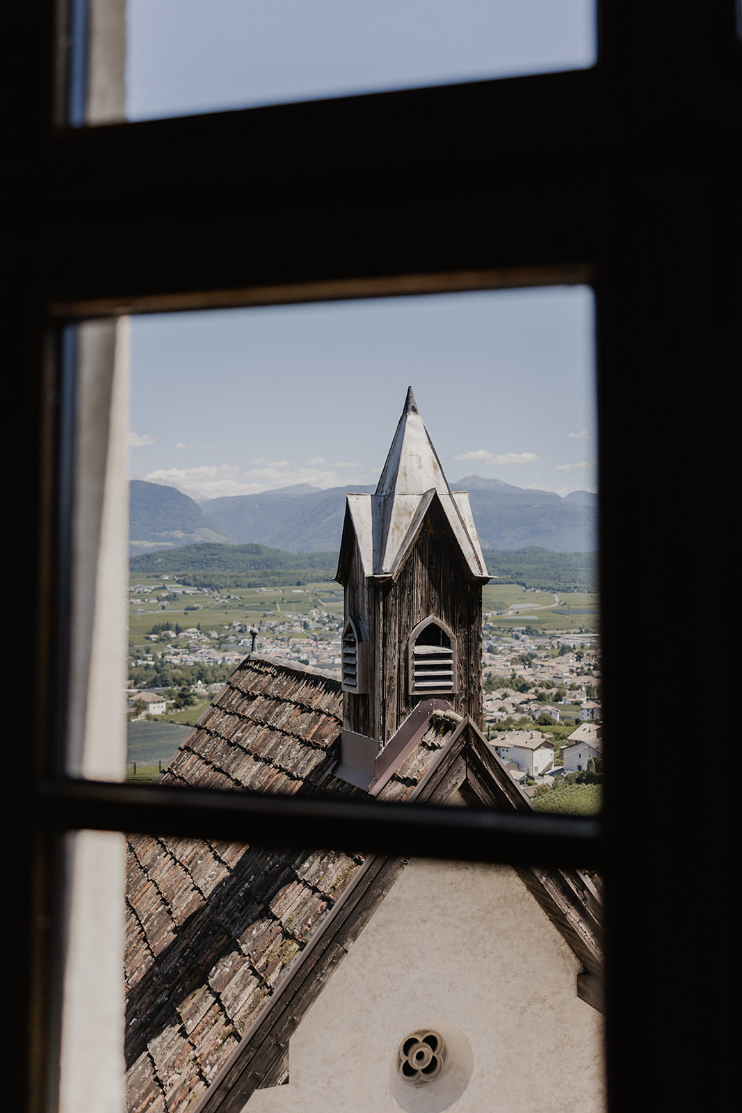 The view towards the bell tower and mountains from Schloss Freudenstein