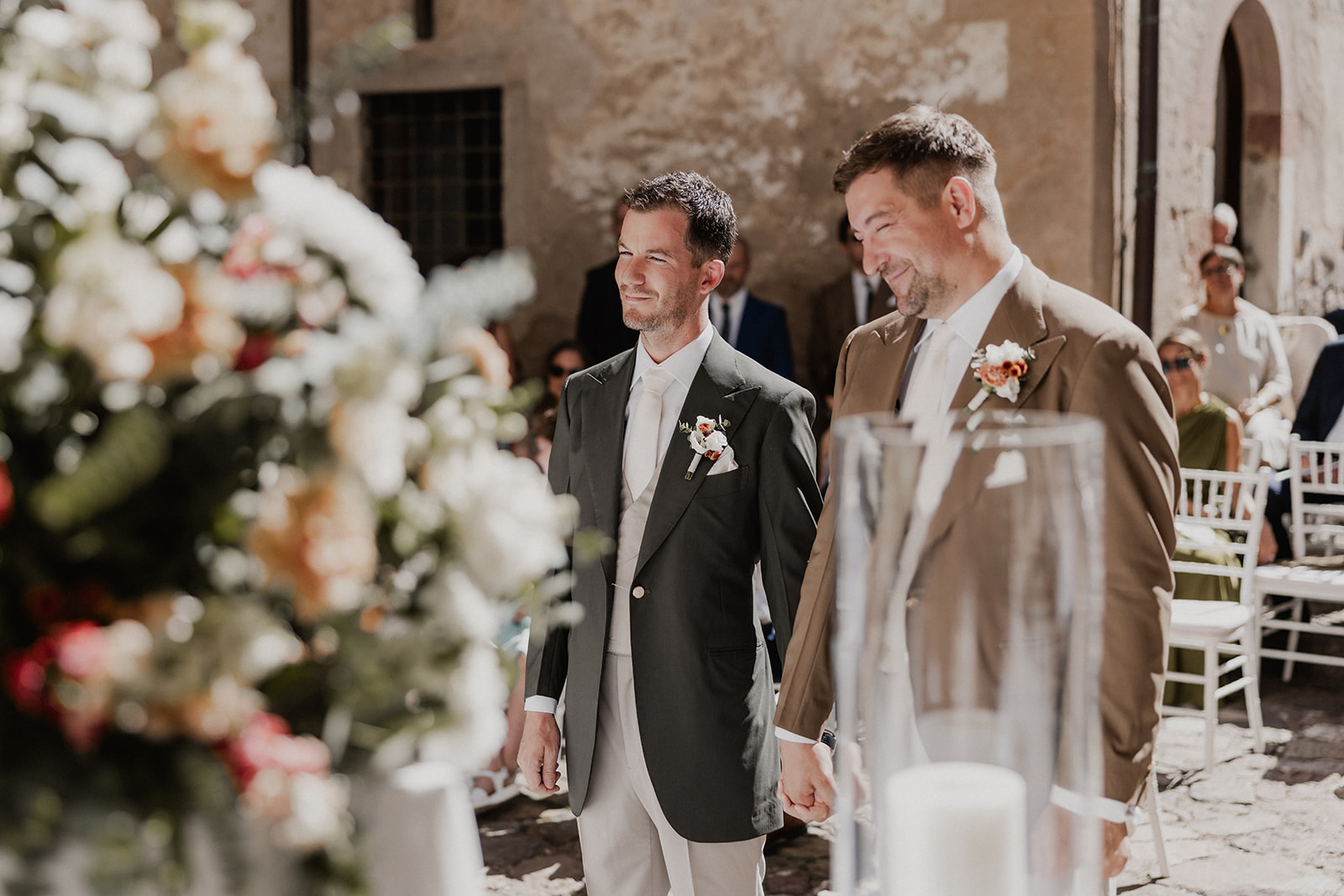Simon and Dima holding hands during their ceremony at Schloss Freudenstein